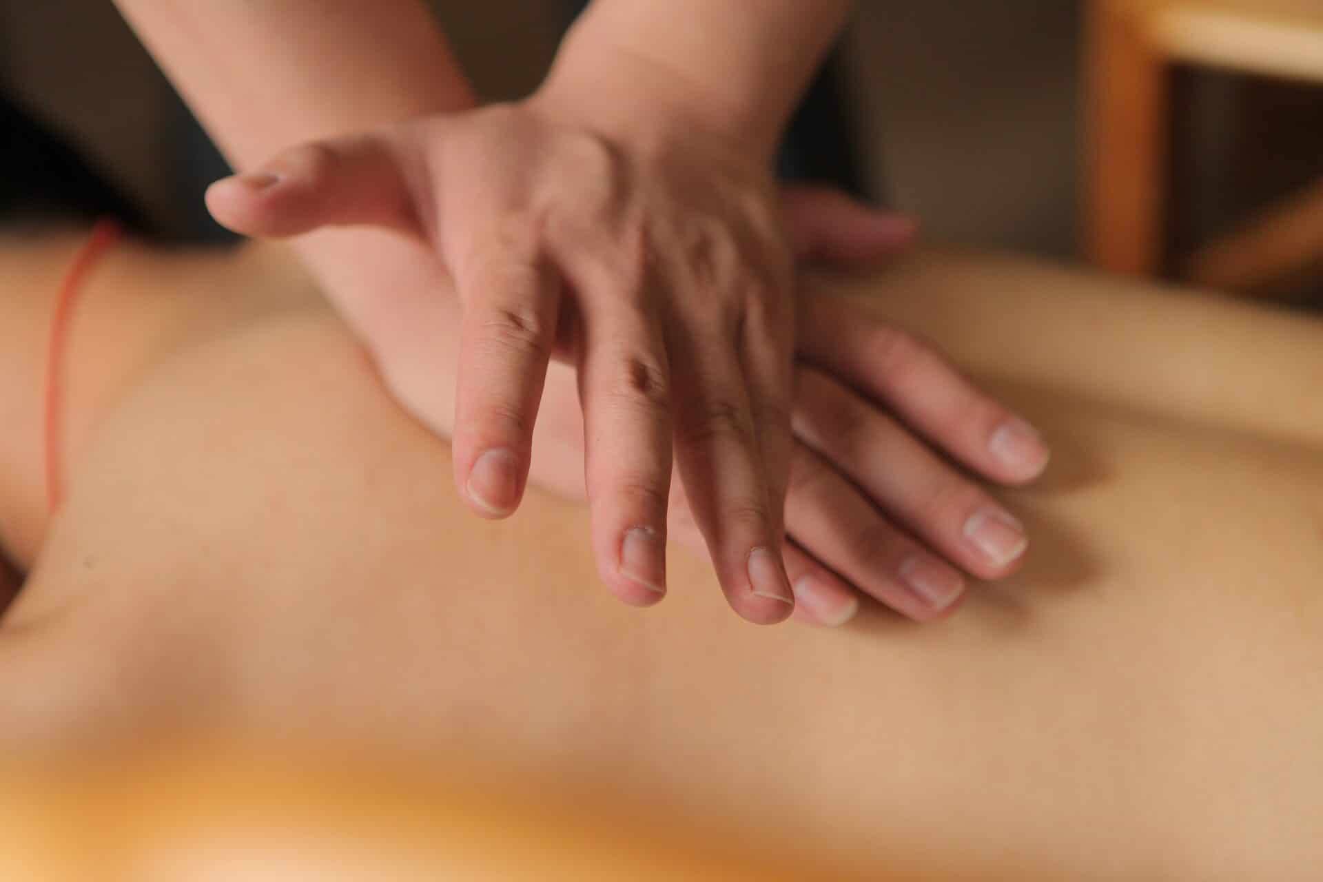man giving lymphatic draining massage in Sutton clinic
