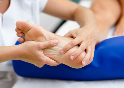 Medical massage at the foot in a physiotherapy center.