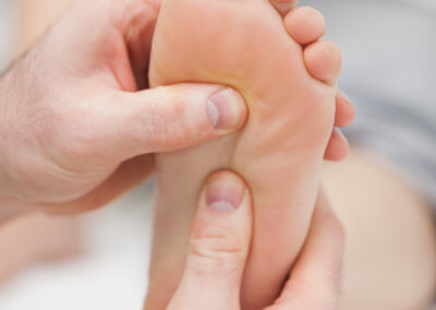 Reflexology massage being made in a room